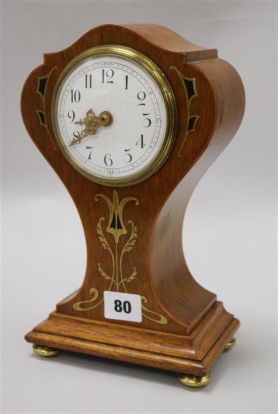 An Edwardian brass and ebony inlaid oak Art Nouveau style mantel timepiece, 25.5cm